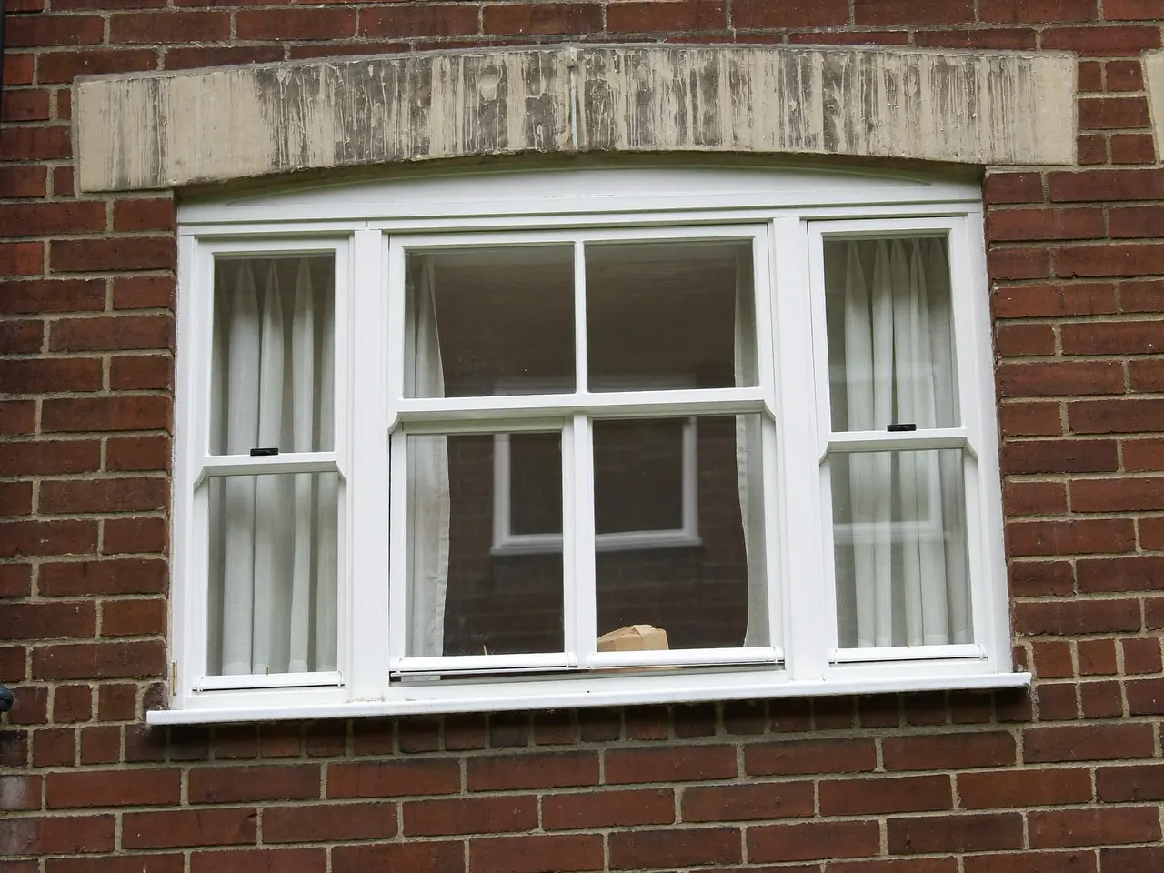 Flush casement double glazing on a brick house