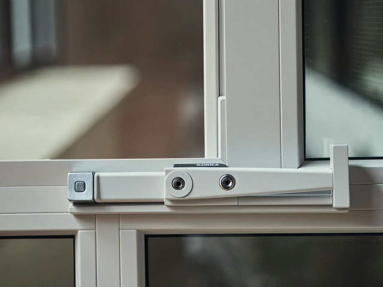 Close-up of a window handle and multi-point lock